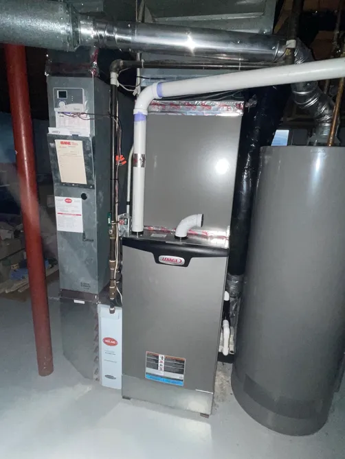New high-efficiency Lennox furnace and water heater installed in a Twin Cities basement by Midland Heating & Cooling