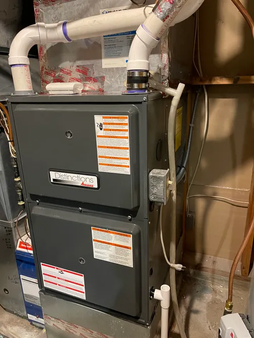 Furnace service and replacement work in a Twin Cities utility room