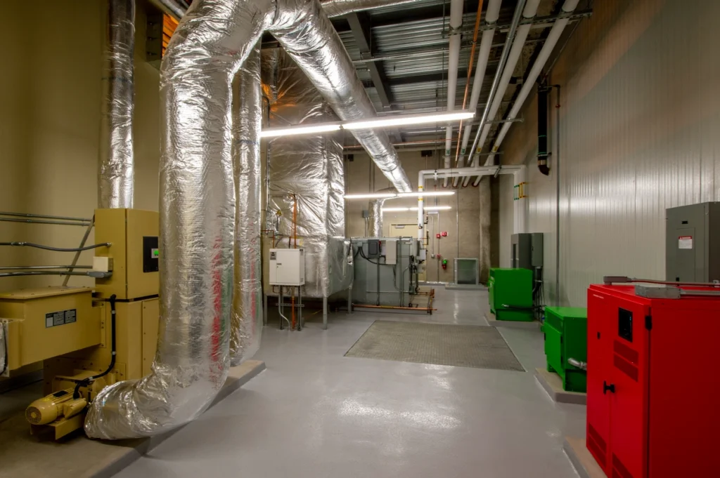 Warehouse Dehumidifier In St. Louis Park, MN 1 A spacious room filled with various pieces of equipment, showcasing a busy and functional environment.