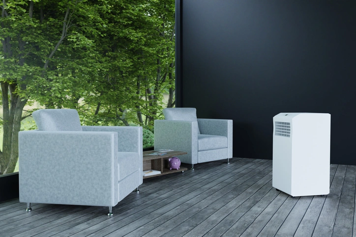 Office Dehumidifier In St. Louis Park, MN 1 A room featuring two chairs and a white air conditioner mounted on the wall.